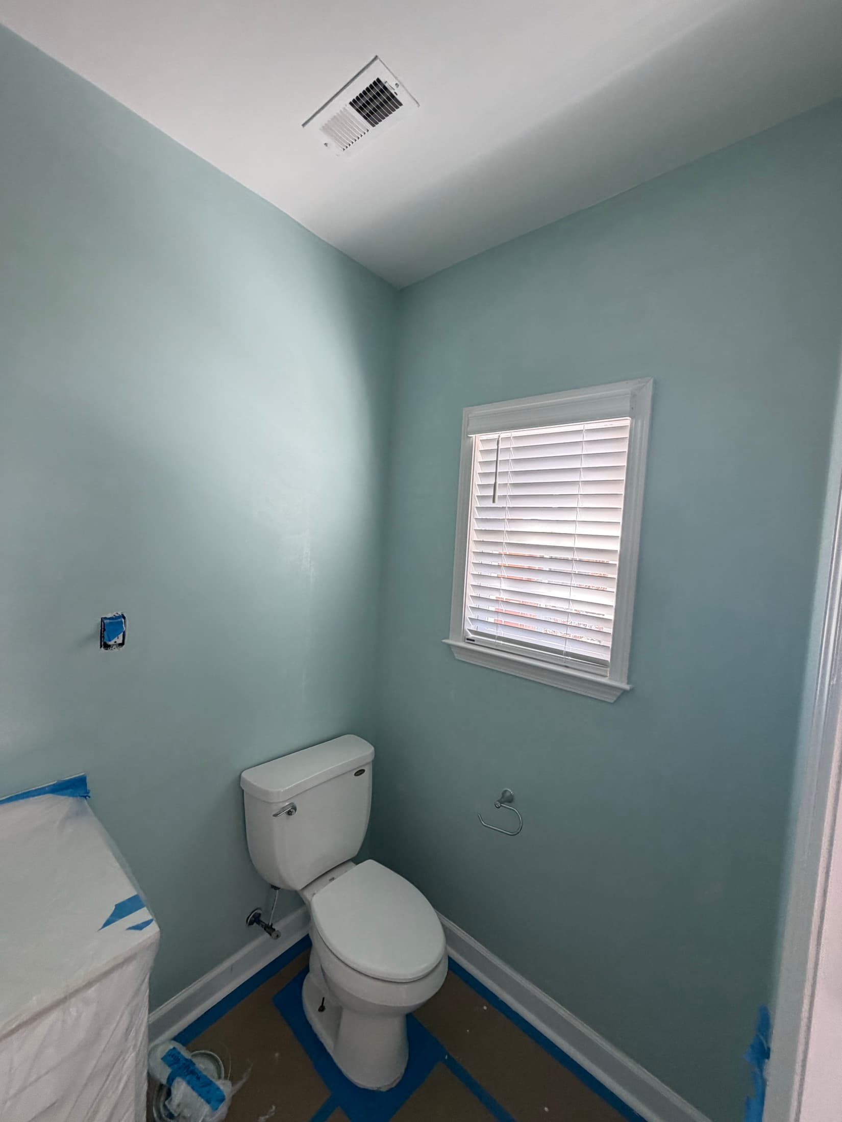 Finished pale blue bathroom with new blinds